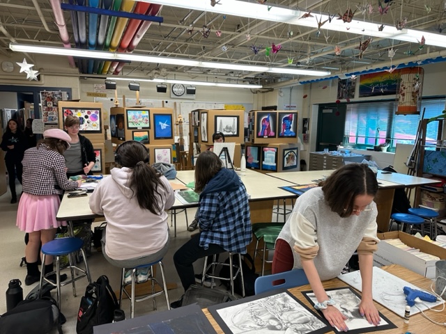 Students prepare their work for the DaVinci Festival.
