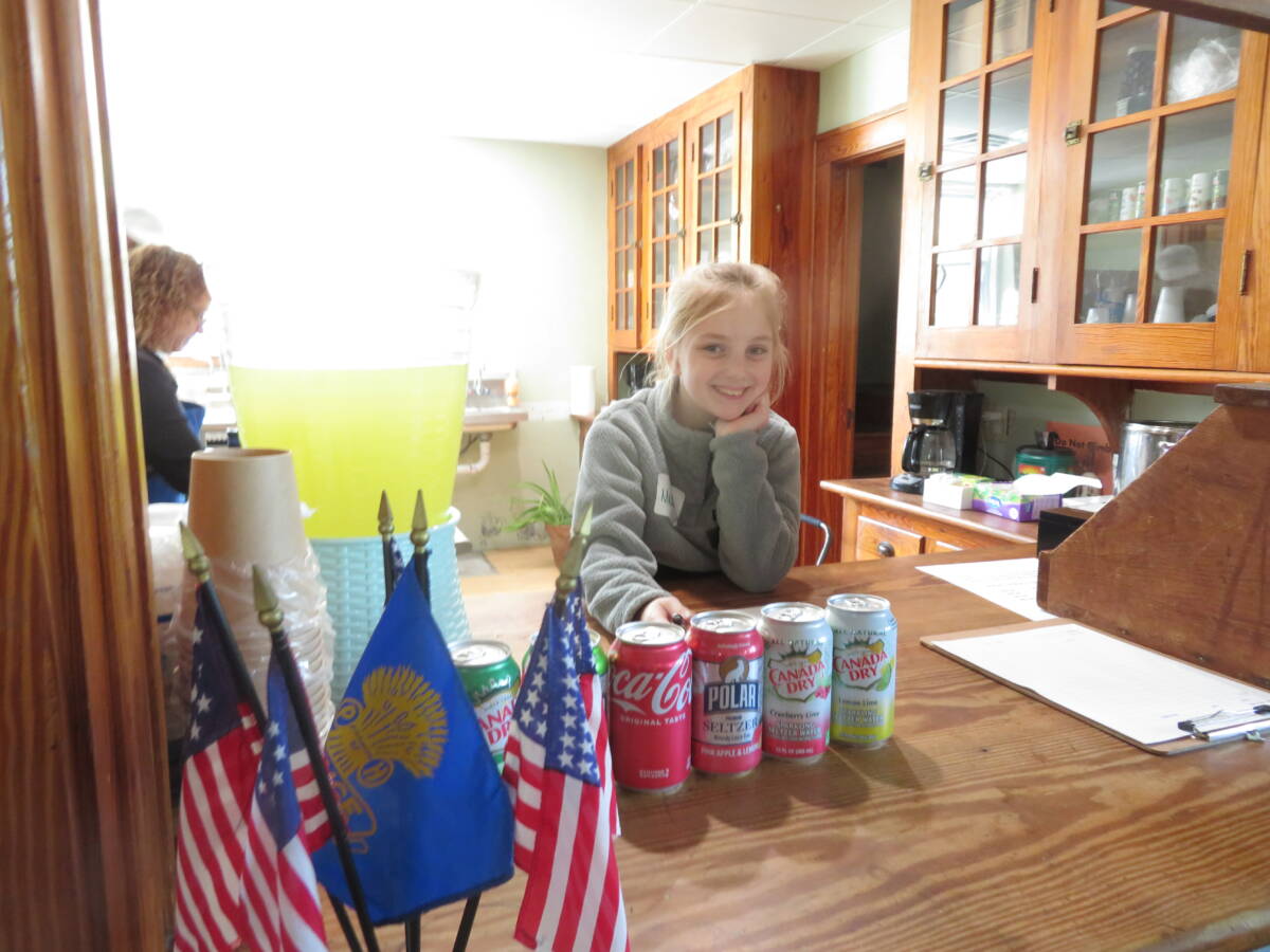 Maddie Ritter, 10, works at the food counter.
