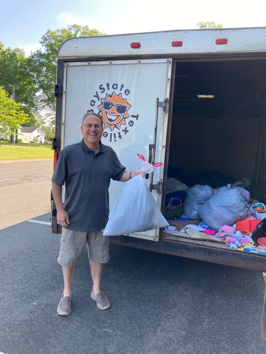 First Selectman Ken Kellogg makes a donation.