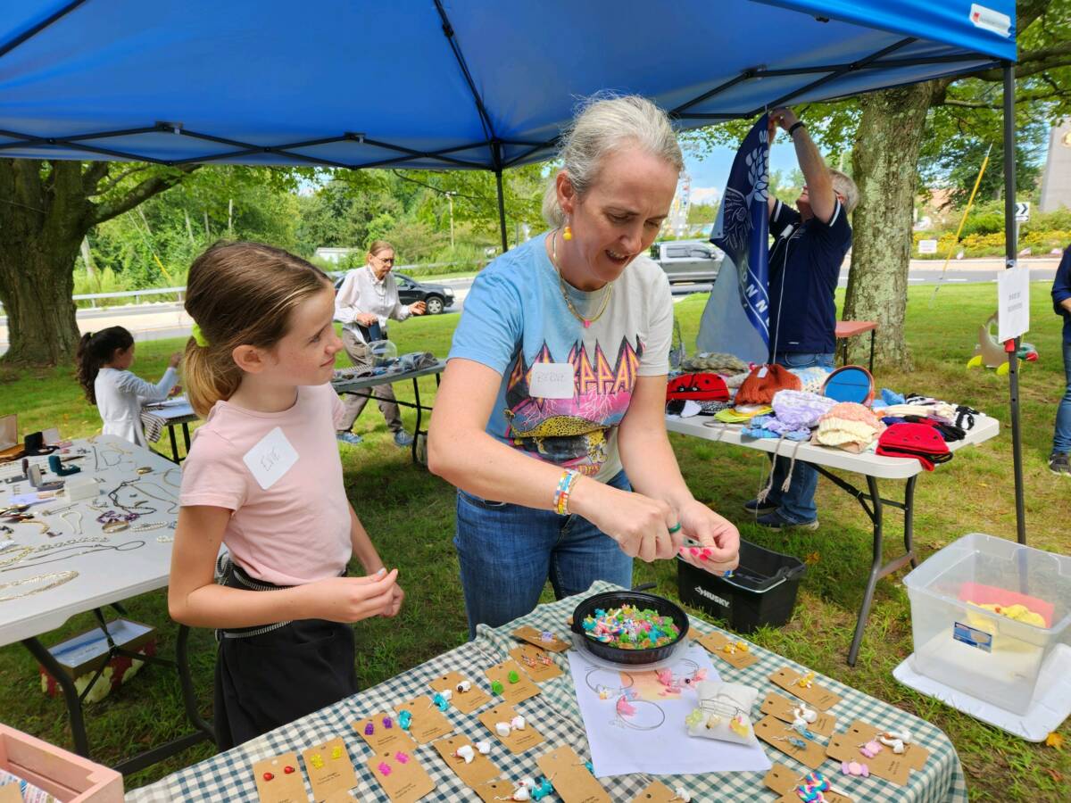 Evie McLaren, 9, makes jewelry with her mother, Bernie.